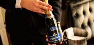 Waiter With Champagne bottle in Roseate London